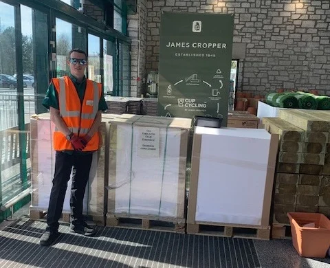A member of staff at Morrisons at Kendal with paper supplied by James Cropper PLC